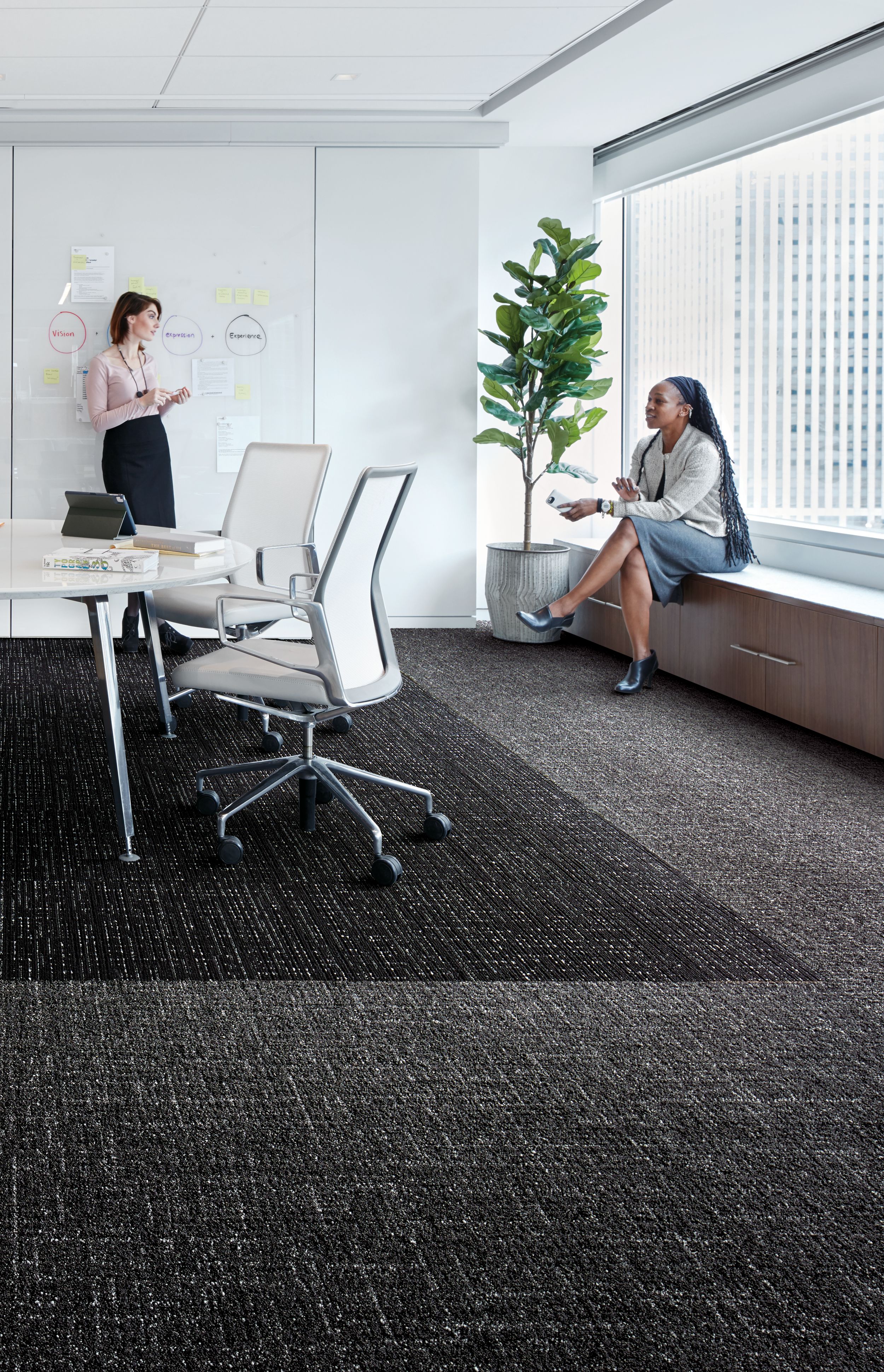 Interface Night Flight carpet tile and Haptic plank carpet tile in office working space with two women talking image number 9